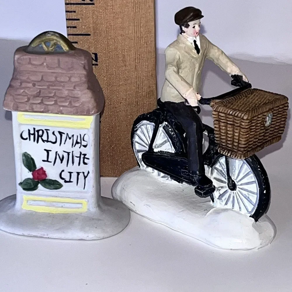 2 Christmas‎ Village Ceramic Figurines Man On Bicycle & Christmas In City Sign